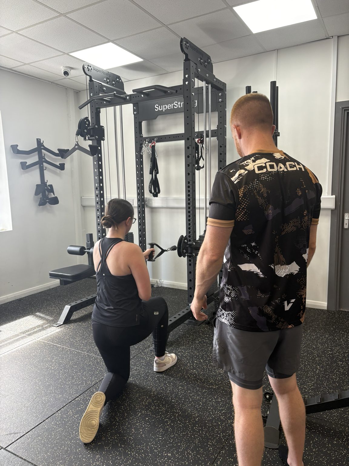 Coaching a kneeling row